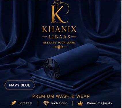 A rolled and folded navy blue fabric product displayed on draped navy fabric, with the brand name Khanix Libaas and text reading 'Navy Blue' and 'Premium Wash & Wear' at the bottom.