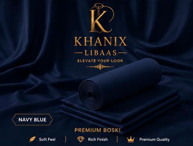 A rolled and folded piece of navy blue fabric displayed on a dark draped satin background, with the brand name Khanix Libaas and text reading 'Navy Blue' and 'Premium Boski' at the bottom.